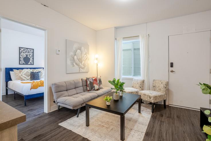 Salle de séjour élégante avec mobilier moderne dans un appartement à Building Rue Barré - 9547-9267-quebec-inc - 1601967 à Southwest, Montreal Salle de séjour élégante avec mobilier moderne dans un appartement à Building Rue Barré - 9547-9267-quebec-inc - 1601967 à Southwest, Montreal