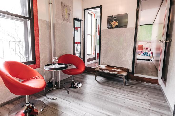 Elegantly designed living room with modern furnishings in an apartment at Building East 78th Street - afi-apartments - 1460130 in Manhattan, New York