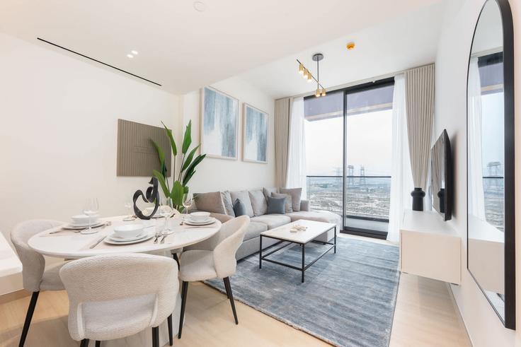 Elegantly designed living room with modern furnishings in an apartment at Building Binghatti Corner - airdxb - 1061301 - DXB in Jumeirah Village, Dubai