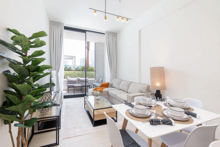 Dining table with stylish chairs in an apartment at Building Street 5 - airdxb - 1274229 - DXB in Jumeirah Village, Dubai Dining table with stylish chairs in an apartment at Building Street 5 - airdxb - 1274229 - DXB in Jumeirah Village, Dubai