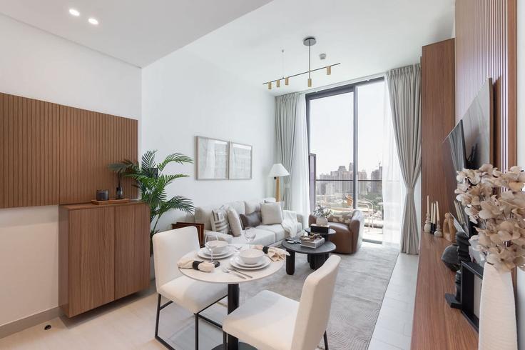 Elegant gestaltetes Wohnzimmer mit moderner Einrichtung in einer Wohnung im Building Kahraba North West - airdxb - 1313350 - DXB in Jumeirah Village, Dubai Elegant gestaltetes Wohnzimmer mit moderner Einrichtung in einer Wohnung im Building Kahraba North West - airdxb - 1313350 - DXB in Jumeirah Village, Dubai