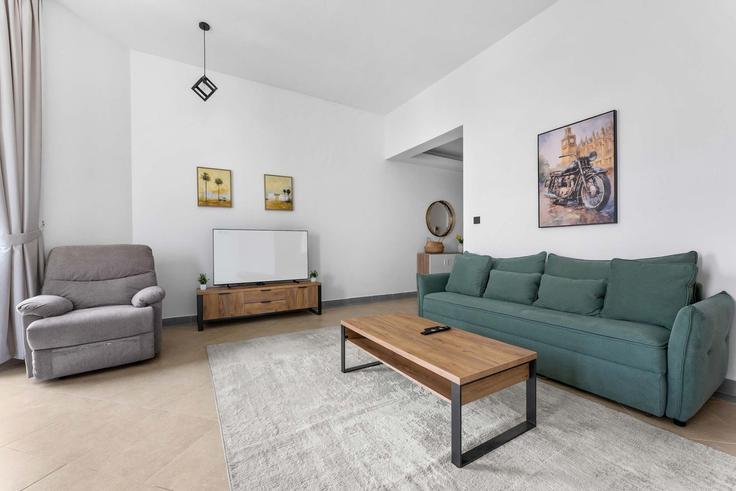 Elegantly designed living room with modern furnishings in an apartment at Building Tariaq Bedon Esm - airdxb - 1325618 in Al Thanyah First, Dubai