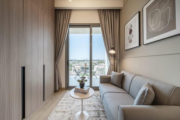 Elegante sala de estar con mobiliario moderno en un apartamento en Building Tulip Street - airstay-holiday-homes-llc-1 - 1525312 en Al Barsha South Fifth, Dubai