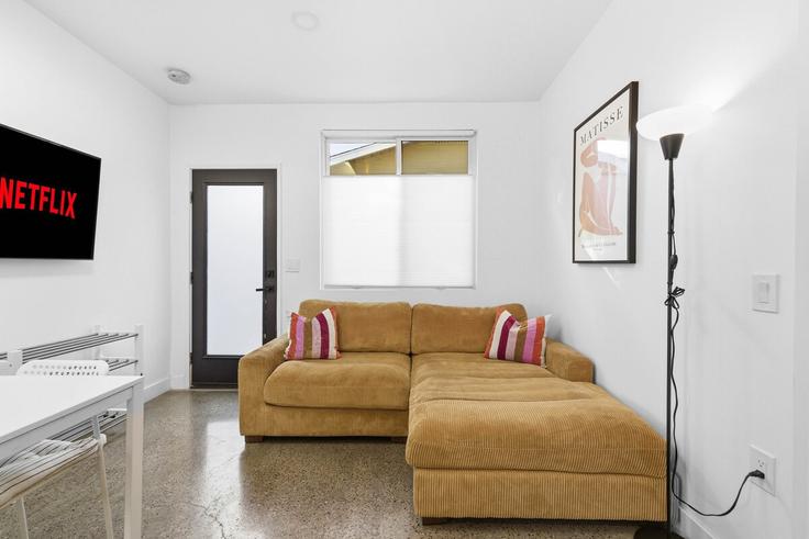 Elegantly designed living room with modern furnishings in an apartment at Building Hawley Boulevard - alexmastor - 1382145 in San Diego, San Diego