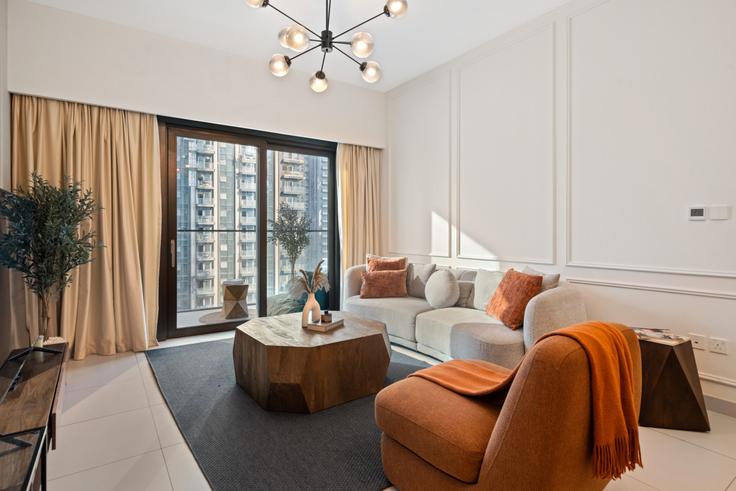 Elegante sala de estar con mobiliario moderno en un apartamento en Building Sheikh Mohammed bin Rashid Boulevard - anfa-vacation-homes-rental-llc - 1643532 en Burj Khalifa, Dubai