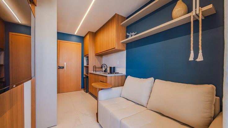 Elegante sala de estar con mobiliario moderno en un apartamento en Building Avenida Simon Bolívar - anfitriao-prime - 1622362 en Jardim Armação, Salvador