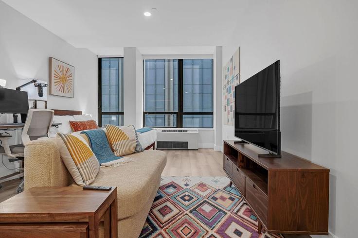 Building Wall Street - anyplaceru - 1053172 - NYC adresindeki bir dairede modern mobilyalarla zarif bir şekilde tasarlanmış oturma odası Manhattan, New York