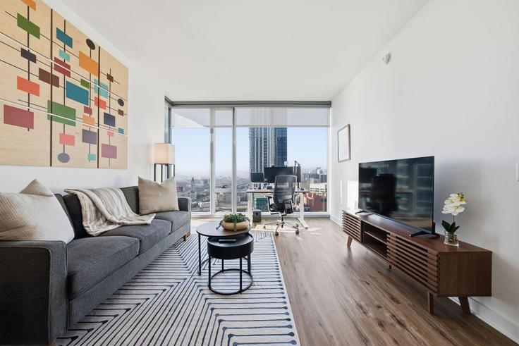 Elegantly designed living room with modern furnishings in an apartment at Building Fremont Street - anyplaceru - 1345547 in San Francisco, San Francisco