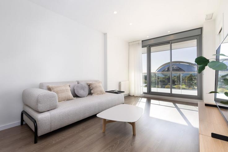 Elegante sala de estar con mobiliario moderno en un apartamento en Building Calle Octavio Vicent Escultor - apartup - 1370219 en Camins al Grau, Valencia