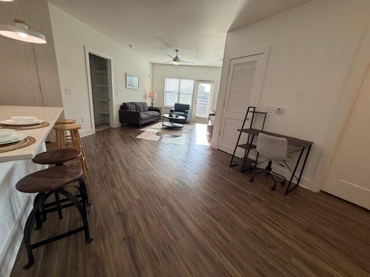 Elegantly designed living room with modern furnishings in an apartment at Building Lincoln Trace Circle - ar-national-short-term-housing - 1328015 in Atlanta, Atlanta