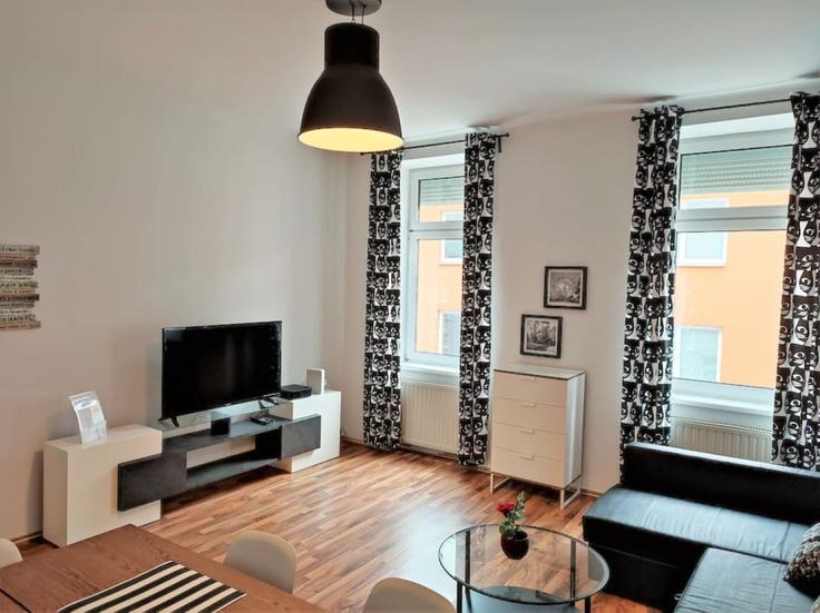 Elegantly designed living room with modern furnishings in an apartment at Building Arnsteingasse - arbiogroup - 1046191 in Vienna, Vienna Elegantly designed living room with modern furnishings in an apartment at Building Arnsteingasse - arbiogroup - 1046191 in Vienna, Vienna