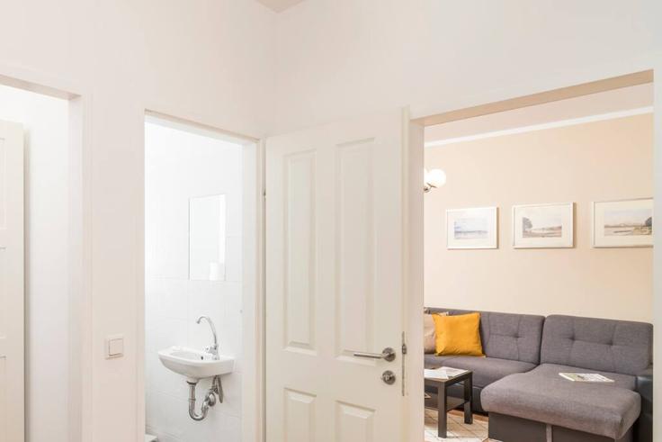Salle de séjour élégante avec mobilier moderne dans un appartement à Building Schulerstraße - arbiogroup - 1046190 - VIE à Vienna, Vienna