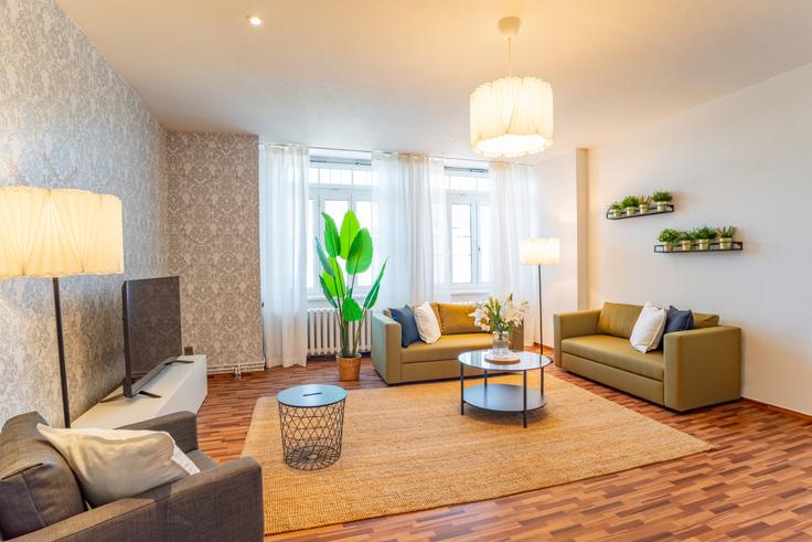 Elegantly designed living room with modern furnishings in an apartment at Building Große Straße - arbiogroup - 1046566 - BER in Strausberg, Strausberg Elegantly designed living room with modern furnishings in an apartment at Building Große Straße - arbiogroup - 1046566 - BER in Strausberg, Strausberg