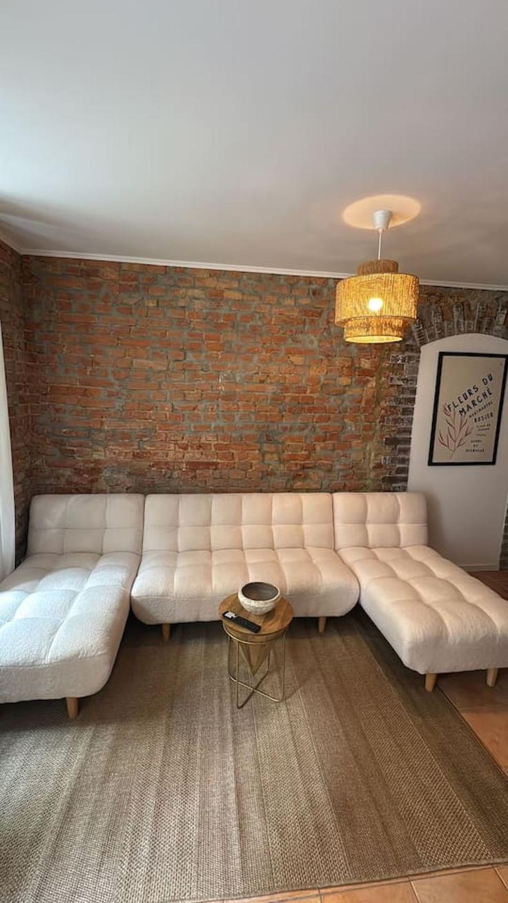 Elegant gestaltetes Wohnzimmer mit moderner Einrichtung in einer Wohnung im Building Christinenstraße - arbiogroup - 1431304 in Berlin, Berlin