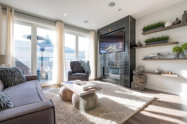 Elegante sala de estar con mobiliario moderno en un apartamento en Building 53 Avenue Southwest - argo - 1634054 en Calgary, Calgary Elegante sala de estar con mobiliario moderno en un apartamento en Building 53 Avenue Southwest - argo - 1634054 en Calgary, Calgary