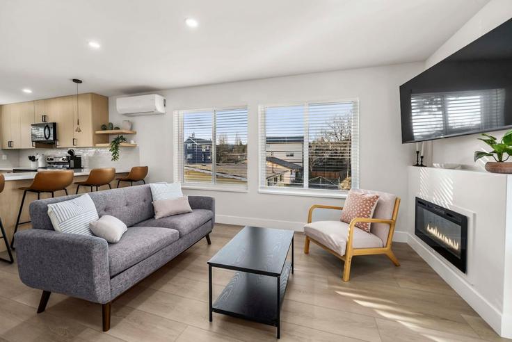 Elegantly designed living room with modern furnishings in an apartment at Building Renton Avenue South - artinproperties - 1407639 in Seattle, Seattle