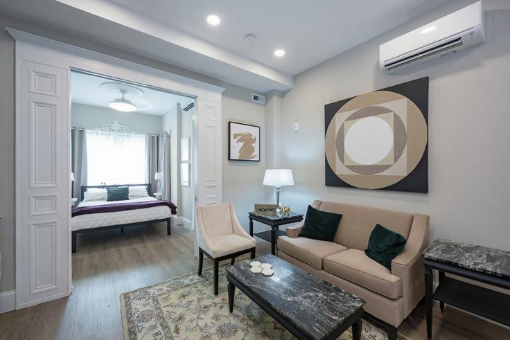 Elegantly designed living room with modern furnishings in an apartment at Building Corcoran Street Northwest - attache-corporate-housing - 1601863 in Washington, Washington