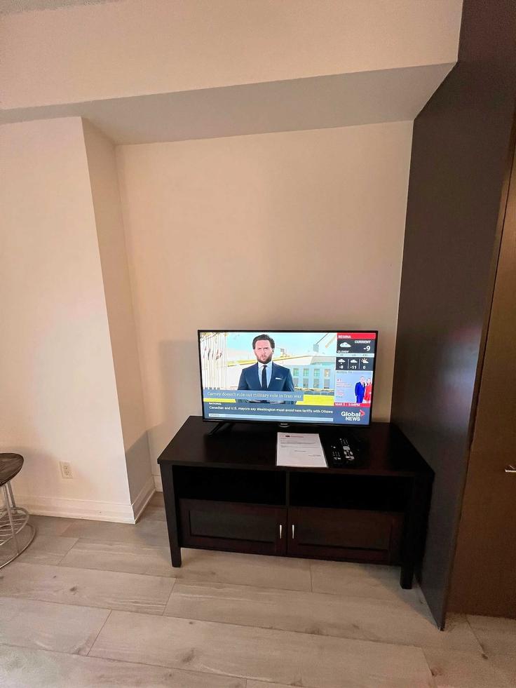 Elegantly designed living room with modern furnishings in an apartment at Building Yorkville Avenue - avalonsuitsyorkville - 1494686 in Old Toronto, Toronto