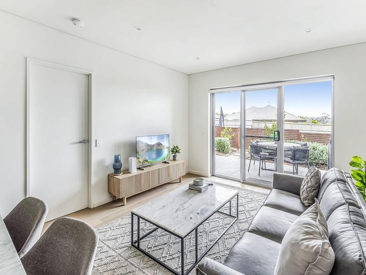 Sala de estar elegantemente projetada com móveis modernos em um apartamento no Building Surfleet Place - belvilla-ag-dancenter-as - 1456598 em Kiama, Kiama