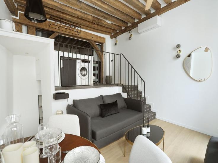 Elegantly designed living room with modern furnishings in an apartment at Building Rue de l'Echaudé - belvilla-ag-dancenter-as - 1562257 in 6th arrondissement, Paris