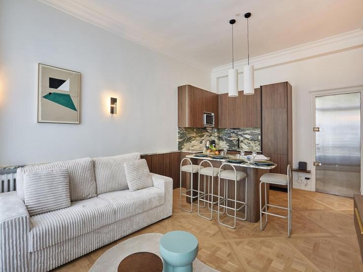 Elegantly designed living room with modern furnishings in an apartment at Building Avenue des Champs-Élysées - belvilla-ag-dancenter-as - 1393946 in 8th arrondissement, Paris
