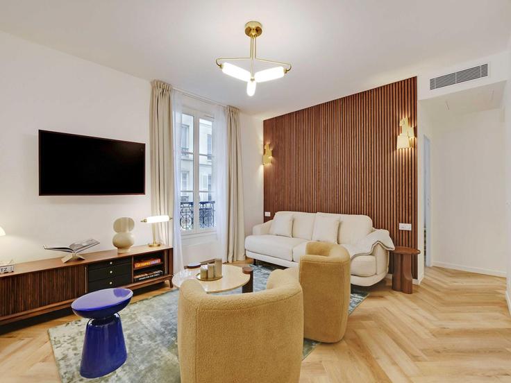 Sala de estar elegantemente projetada com móveis modernos em um apartamento no Building Rue Saint-Bernard - belvilla-ag-dancenter-as - 1408315 em 11th arrondissement, Paris Sala de estar elegantemente projetada com móveis modernos em um apartamento no Building Rue Saint-Bernard - belvilla-ag-dancenter-as - 1408315 em 11th arrondissement, Paris