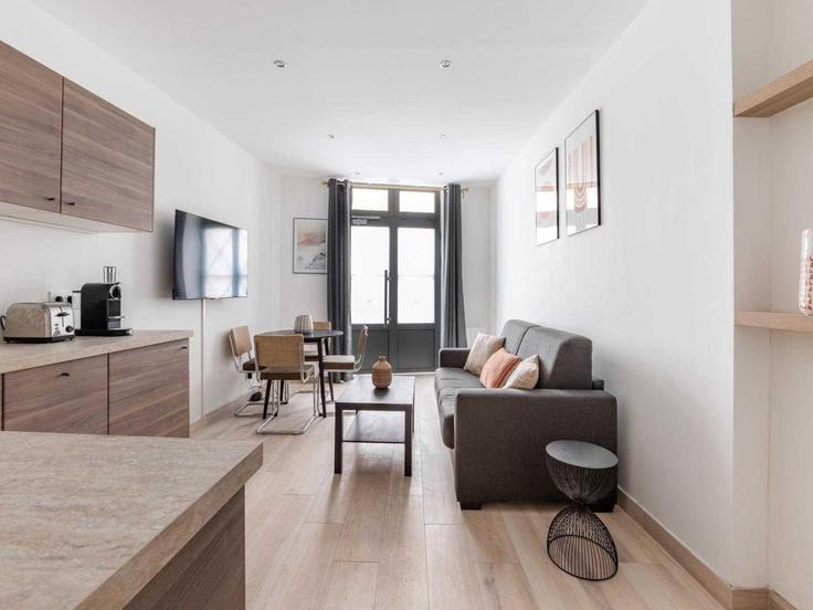 Elegantly designed living room with modern furnishings in an apartment at Building Rue de Savoie - belvilla-ag-dancenter-as - 1396720 in 6th arrondissement, Paris