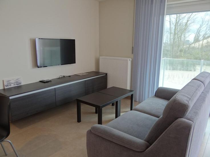 Sala de estar elegantemente projetada com móveis modernos em um apartamento no Building Kinderlaan - belvilla-ag-dancenter-as - 1408071 em Koksijde, Koksijde Sala de estar elegantemente projetada com móveis modernos em um apartamento no Building Kinderlaan - belvilla-ag-dancenter-as - 1408071 em Koksijde, Koksijde