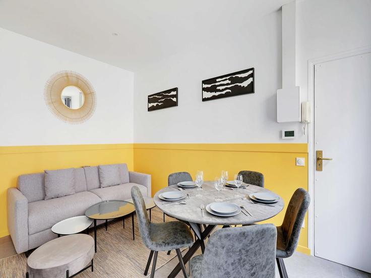 Elegantly designed living room with modern furnishings in an apartment at Building Boulevard Saint-Martin - belvilla-ag-dancenter-as - 1415289 in 3rd arrondissement, Paris