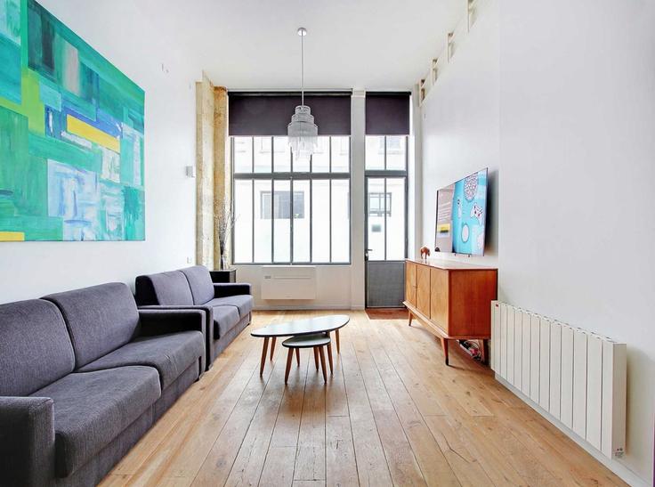 Salle de séjour élégante avec mobilier moderne dans un appartement à Building Rue du Faubourg Saint-Martin - belvilla-ag-dancenter-as - 1446599 à 10th arrondissement, Paris Salle de séjour élégante avec mobilier moderne dans un appartement à Building Rue du Faubourg Saint-Martin - belvilla-ag-dancenter-as - 1446599 à 10th arrondissement, Paris