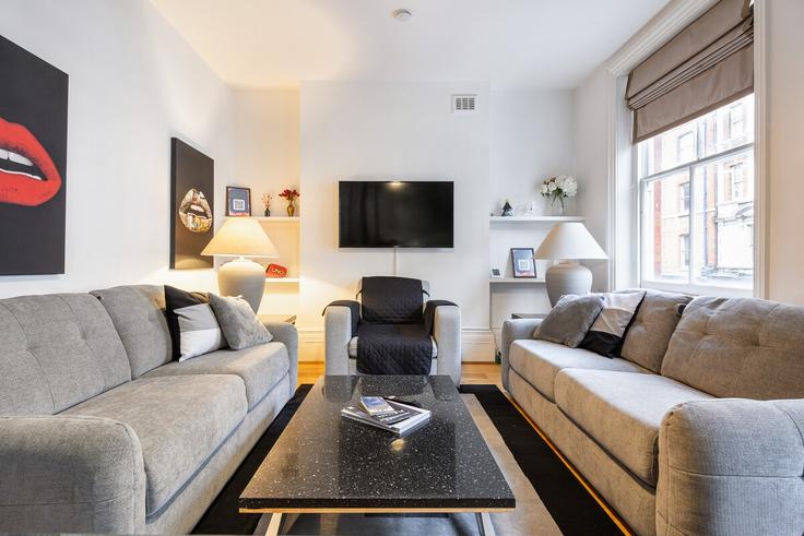 Elegant gestaltetes Wohnzimmer mit moderner Einrichtung in einer Wohnung im Building Gosfield Street - big-ben-stays - 1436128 in City of Westminster, London