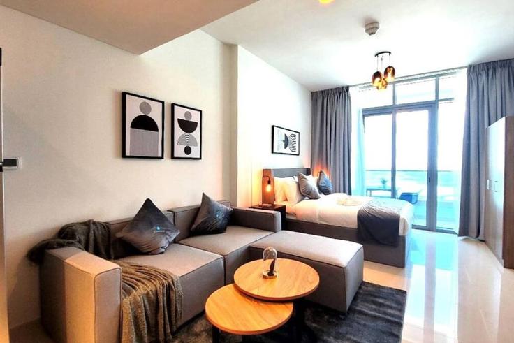 Salle de séjour élégante avec mobilier moderne dans un appartement à Building Ar Reem Street - bloomfields-holiday-home - 1474801 à Al Reem Island, Abu Dhabi