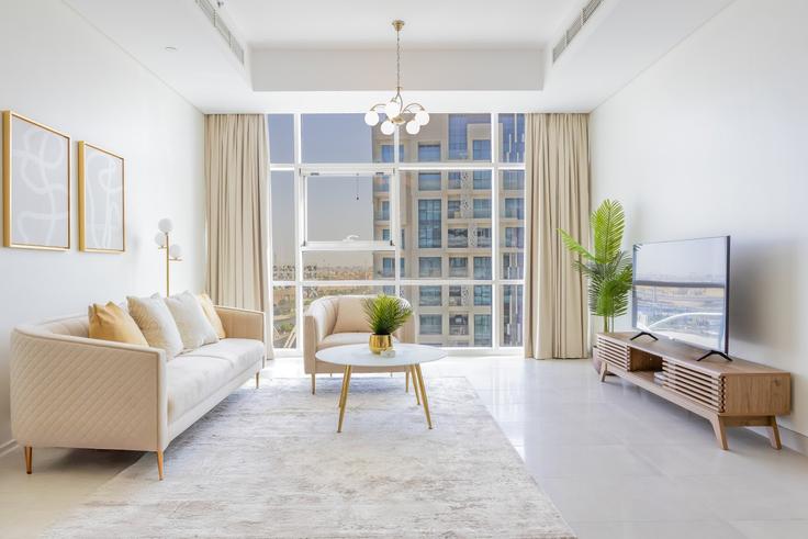 Elegante sala de estar con mobiliario moderno en un apartamento en Building Qussar An Nisaylah Street - bloomfields-holiday-home - 1474976 en Al Rahah, Abu Dhabi Elegante sala de estar con mobiliario moderno en un apartamento en Building Qussar An Nisaylah Street - bloomfields-holiday-home - 1474976 en Al Rahah, Abu Dhabi
