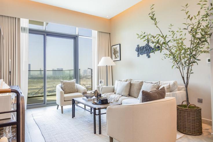 Elegante sala de estar con mobiliario moderno en un apartamento en Building Tariaq Bedon Esm - bloomfields-holiday-home - 1474980 en Al Jaddaf, Dubai Elegante sala de estar con mobiliario moderno en un apartamento en Building Tariaq Bedon Esm - bloomfields-holiday-home - 1474980 en Al Jaddaf, Dubai