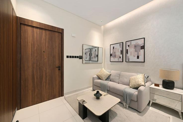 Salle de séjour élégante avec mobilier moderne dans un appartement à Building Street 65 - bloomfields-holiday-home - 1630836 à Al Barsha South Third, Dubai Salle de séjour élégante avec mobilier moderne dans un appartement à Building Street 65 - bloomfields-holiday-home - 1630836 à Al Barsha South Third, Dubai