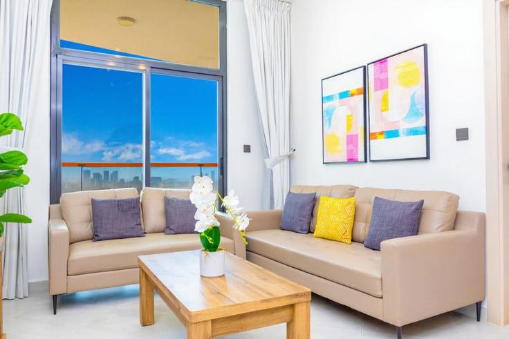 Elegantly designed living room with modern furnishings in an apartment at Building Tariaq Bedon Esm - bloomfields-holiday-home - 1474940 in Al Jadaf, Dubai