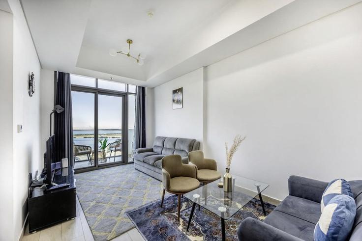 Elegantly designed living room with modern furnishings in an apartment at Building Tariaq Bedon Esm - bloomfields-holiday-home - 1475215 in Al Jadaf, Dubai