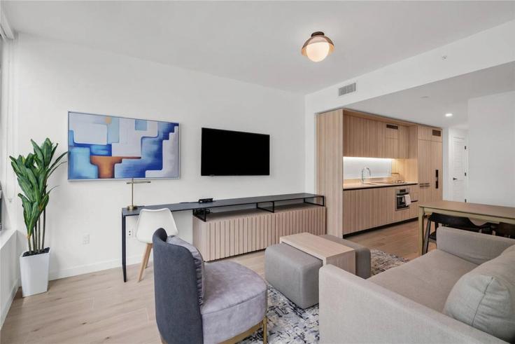 Elegante sala de estar con mobiliario moderno en un apartamento en Building North Miami Avenue - blues-vacation-rentals-llc - 1520402 en Miami, Miami Elegante sala de estar con mobiliario moderno en un apartamento en Building North Miami Avenue - blues-vacation-rentals-llc - 1520402 en Miami, Miami