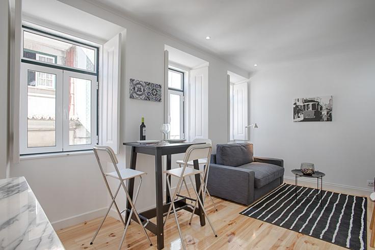 Elegantly designed living room with modern furnishings in an apartment at Building Travessa Cruz de Soure - bmyguest - 1468369 in Misericórdia, Lisbon
