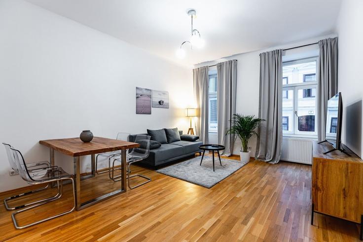Elegante sala de estar con mobiliario moderno en un apartamento en Building Nödlgasse 8 - bosu-gmbh - 1500242 en Vienna, Vienna Elegante sala de estar con mobiliario moderno en un apartamento en Building Nödlgasse 8 - bosu-gmbh - 1500242 en Vienna, Vienna