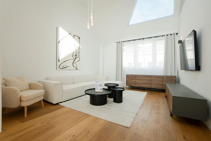 Elegante sala de estar con mobiliario moderno en un apartamento en Building Fockygasse 6 - bosu-gmbh - 1500389 en Vienna, Vienna Elegante sala de estar con mobiliario moderno en un apartamento en Building Fockygasse 6 - bosu-gmbh - 1500389 en Vienna, Vienna