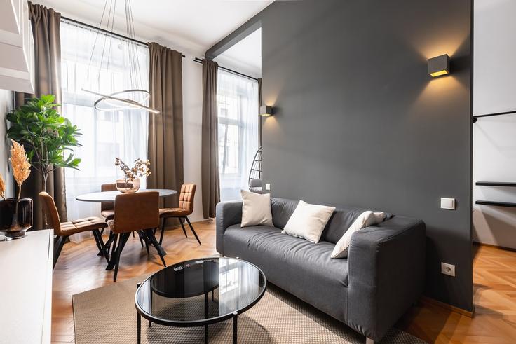 Vienna ViennaのBuilding Fockygasse - bosu-gmbh - 1500258のアパートメントにある、モダンな家具を備えたエレガントなデザインのリビングルーム Vienna ViennaのBuilding Fockygasse - bosu-gmbh - 1500258のアパートメントにある、モダンな家具を備えたエレガントなデザインのリビングルーム
