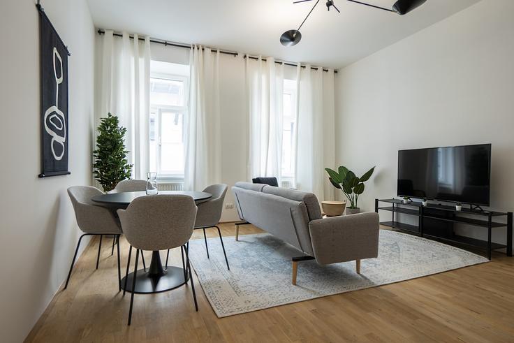 Elegant gestaltetes Wohnzimmer mit moderner Einrichtung in einer Wohnung im Building Urban-Loritz-Platz 5 - bosu-gmbh - 1500303 in Vienna, Vienna