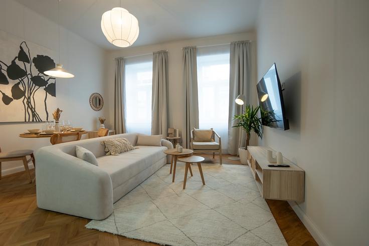 Elegant gestaltetes Wohnzimmer mit moderner Einrichtung in einer Wohnung im Building Urban-Loritz-Platz - bosu-gmbh - 1500313 in Vienna, Vienna
