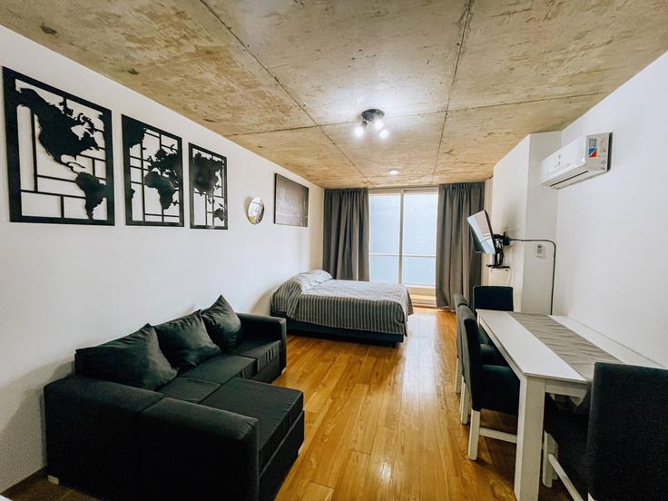 Elegantly designed living room with modern furnishings in an apartment at Building Fitz Roy 2077 - bt-homes - 1500816 in Buenos Aires, Buenos Aires