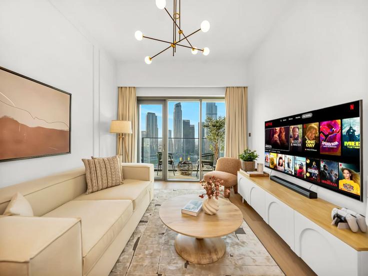 Elegantly designed living room with modern furnishings in an apartment at Building Burj Khalifa Boulevard - caabi-boutique-homes - 1496873 in Burj Khalifa, Dubai