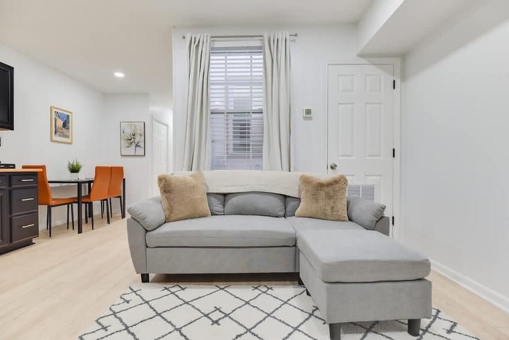 Elegantly designed living room with modern furnishings in an apartment at Building Raum Street Northeast - capital-city-stays - 1388282 in Washington, Washington