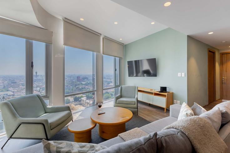 Salle de séjour élégante avec mobilier moderne dans un appartement à Building Seye - capitalia - 1029087 - MEX à Mexico City, Mexico City Salle de séjour élégante avec mobilier moderne dans un appartement à Building Seye - capitalia - 1029087 - MEX à Mexico City, Mexico City