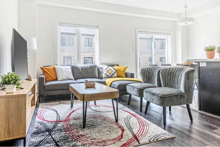 Elegantly designed living room with modern furnishings in an apartment at Building 7 Wakeling Drive - casa-co-host-1 - 1698519 in Brantford, Brantford
