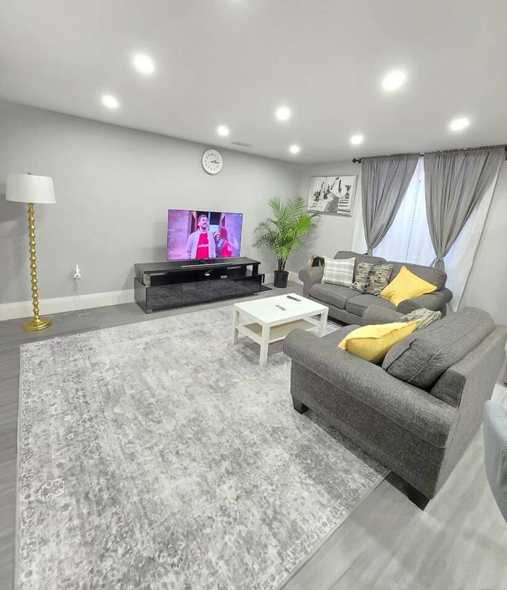 Elegantly designed living room with modern furnishings in an apartment at Building 8 sass crescent - casa-co-host-1 - 1698613 in Brant, Brant